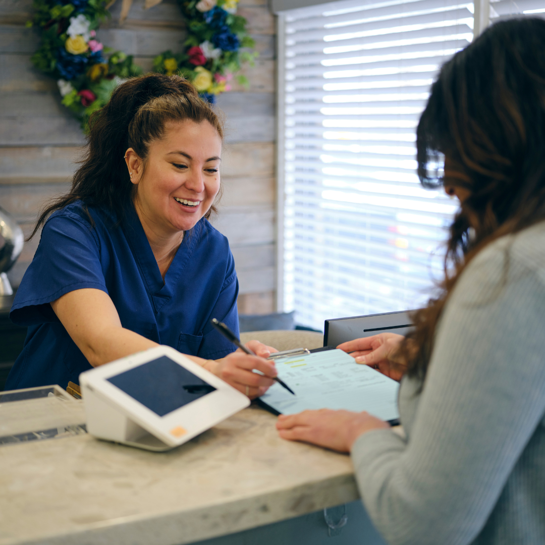 Reception team speaking with a patient