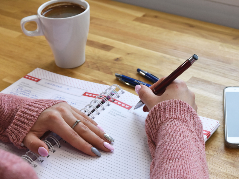 A person reviewing important paperwork at a table.